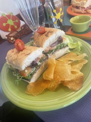 Vegan sandwich with eggplant, vegan cheese, olives. Served with potato chips  at Viva la Pepa in El Calafate
