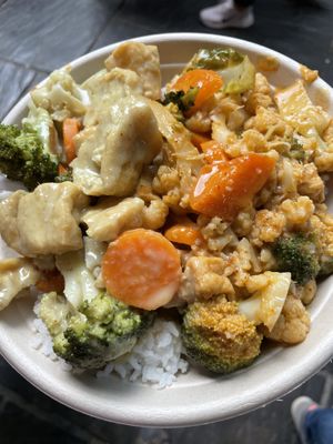 Mix of red and green curries on rice  at Vegan Thai Food - Food Stall in North West London
