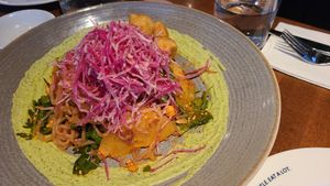 This is light and refreshing. Crispy onion, raw shredded beets. Noodles and fried tofu. Pretty good at Earls Kitchen + Bar - South Common in Edmonton