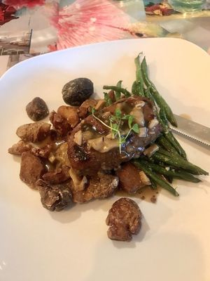 Impossible Salisbury steak with roasted rainbow potatoes and garlicy green beans  at Fiction Kitchen in Raleigh