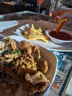 Cornmeal crusted fried mushrooms with old bay mayo and lions mane Rangoon with sweet chili sauce at Fiction Kitchen in Raleigh