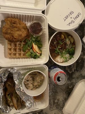 The trifecta- chickn & waffles, brisket bowl & Lion’s mane krab dip  at Fiction Kitchen in Raleigh