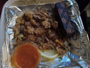 Fried oyster mushrooms,  Buffalo sauce, and grilled tofu. at Fiction Kitchen in Raleigh