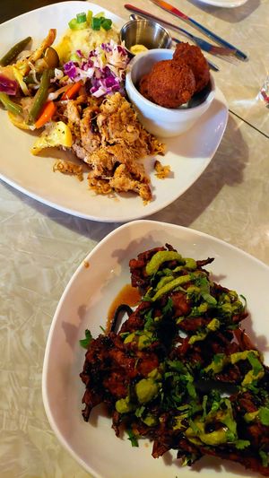 Southern platter with hush puppies and squash fritters with mint sauce at Fiction Kitchen in Raleigh