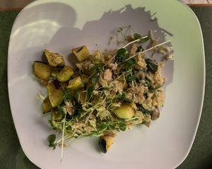 Risotto - Rice, cremini mushrooms, spinach in truffled cashew cream w/ roasted carrots, turnips & a pea shoot, vegan Parmesan & black pepper almond salad  at Fiction Kitchen in Raleigh