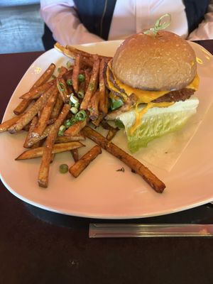 Double smashed cheeseburger on gluten free bun and house made pickle dipped potato fries  at Fiction Kitchen in Raleigh