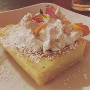 Lemon bar with coconut whip cream  at Fiction Kitchen in Raleigh