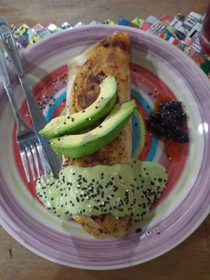 Huge Burrito with tasty vegan-meat filling, delicious & creamy green souce at Huerto En El Barrio in Guadalajara