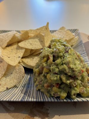 Hummus , guacamole hash up with mango and nachos   at A Corre Vexeta in Santiago De Compostela