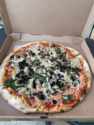Vegan pizza with olives, spinach artichoke   at Tony's Pizza in Flagler Beach