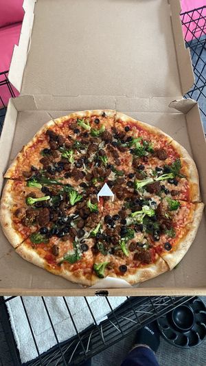 Vegan pizza with cheese, meatballs, sausage, black olives, spinach and broccoli.  at Tony's Pizza in Flagler Beach