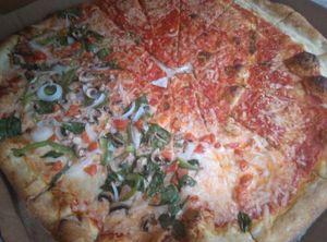 Half happy vegan and half Margherita at Tony's Pizza in Flagler Beach