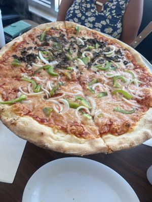 Vegan mozzarella with pepper, onions and mushrooms on half!   at Tony's Pizza in Flagler Beach