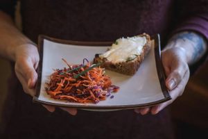 Ici en accompagnement de notre râpé de saison (carotte/choux rouge), une tartinade de noix de cajou aux fines herbes sur pain maison.  at Les Terres d'en Haut in Innimond