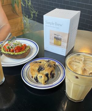 Blueberry lemon scone, avacado toast with roasted pepper, and two iced oatmilk lattes    at Leslie Coffee Co in Wichita