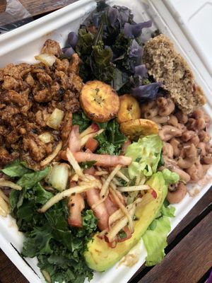 All of the sides are vegan.  Rice and peas fill the side of the container with the soy curls.  at Rasta in Nassau