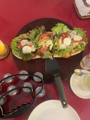 Vegan pizza and tambourine I was given to accompany the live music!   at Herbolarium in Santa Fe