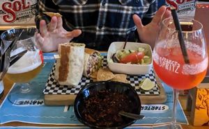 Burrito, salad and tequila sunrise at Pura Vida Vegan Tacos in Antwerpen