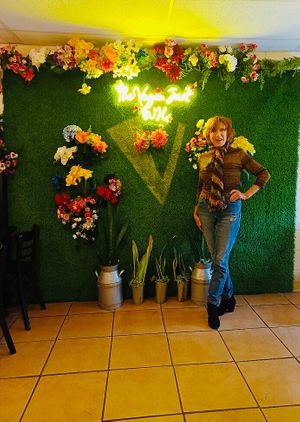 Me in front of the backdrop.  at The Vegan Joint in Woodland Hills