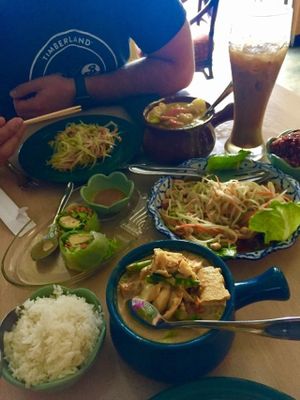 Garden curry with tofu, yellow curry with tofu, green papaya salad, avocado spring rolls, and Thai coffee with a coconut milk float. All vegan.  at Tina's Garden Gourmet Cafe in Hilo