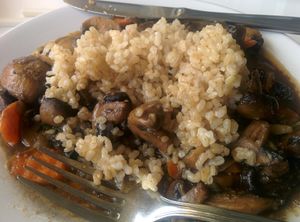 Sauteed mushrooms, vegetables over brown rice at Loving Hut - Sunset District in San Francisco