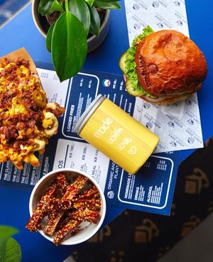 Off the menu: loaded Fire Fries, Chinese Chili Tofu with Hoisin, Mango Lassi shake, and The Classic burger.  at Eden Jaxx - Nørrebro in Copenhagen
