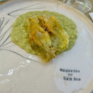 Zucchini and lemon risotto with fried zucchini flower  at MOM Cucina Vegetale Creativa in Fano Adriano