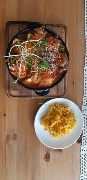Tofu dumplings baked in the oven with tomato-sauce at Pod Przykrywką in Wroclaw