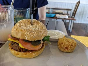 Lionel Cheezburger - A sweet potato & black bean patty, cheez, mustard, tomato, dill pickles, & aioli on a sesame brioche bun. #Veganuary at Cinnamon & Co in West End