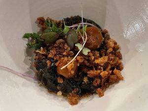 Black Garlic Risotto with Charred Eggplant and Yuzu Kishinev Tomato Confit  at natuRe waikiki in Honolulu