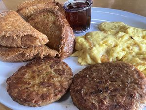 Vegan French Toast w/ “eggs” and “sausage"  at Biscuits Cafe in Surprise