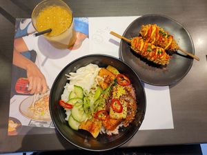 Tropical Juice (Small), Gochujang Rice Bowl with Silken Tofu and Vegan K-Dogs at Wagamama in Swansea