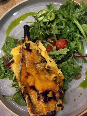 Eggplant with smoked cheese and salad at Vegan Garden Budapest in Budapest