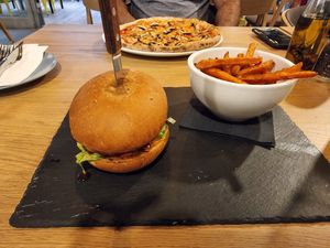 Garden burger and mushroom pizza at Vegan Garden Budapest in Budapest