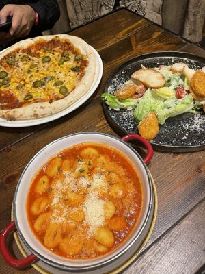 Picante pizza, cesar salad and gnocci.   at Vegan Garden Budapest in Budapest