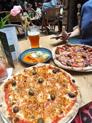 Vegan tuna and vegan BBQ pizza at Vegan Garden Budapest in Budapest