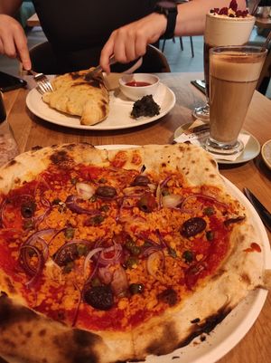 Tuna pizza and calzone: both well made and delicious at Vegan Garden Budapest in Budapest