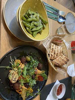 salted edamame and the hummus plate with pita  at Vegan Garden Budapest in Budapest
