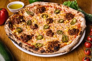 Picante:
Pizza sauce, vegan mozzarella, jalapeno peppers, sweet corn, vegan Bolognese at Vegan Garden Budapest in Budapest