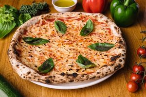 Margherita:
Pizza sauce, vegan mozzarella, fresh basil at Vegan Garden Budapest in Budapest