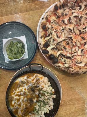 Paprikash, pickles and funghi pizzaa  at Vegan Garden Budapest in Budapest
