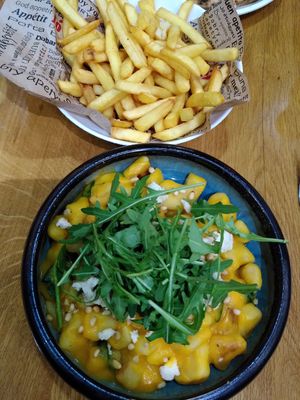 Fries and gnoccis with pumkin sauce at Vegan Garden Budapest in Budapest