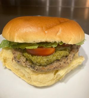 Homemade Mozzarella & blackbean burger topped with pesto  at The Green Kitchen in Northwich