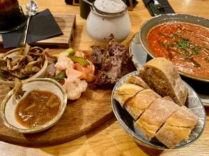 Appetizers - house board and tomato soup at Pierwszy Stopien in Krakow