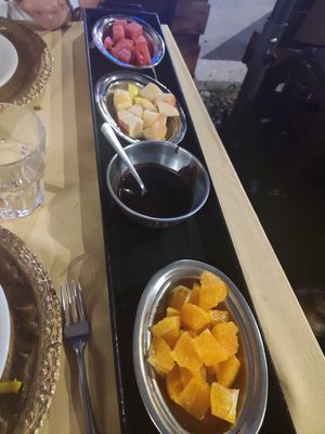 Dessert: fruit with melted chocolate at Serendib in Milan