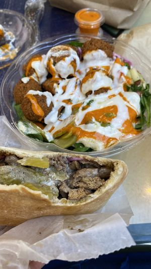 Falafel Bowl (I added the vegan sauces: red, mazbout, garlic) and shawarma sandwich !  at Falafel Inc - Tysons Corner in Tysons Corner