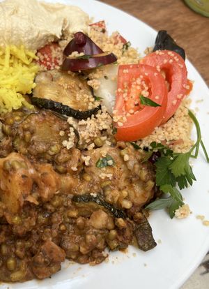 Vegan moussaka (front) with couscous, hummus, & rice sides  at Silk Road Cafe in Dublin