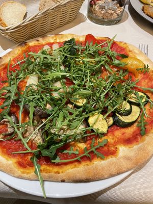 Vegetable pizza without cheese, with extra rucola  at L Fudlè in Selva Di Val Gardena