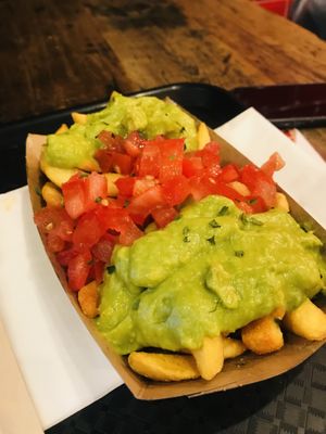 Loaded fries with guacamole and tomatoes   at My Currywurst in Stuttgart