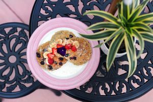 Banana blueberry pancakes served with organic fruit and vanilla infused maple syrup at Elixir De La Lune in La Jolla